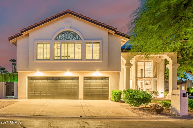 mediterranean / spanish-style house featuring a garage