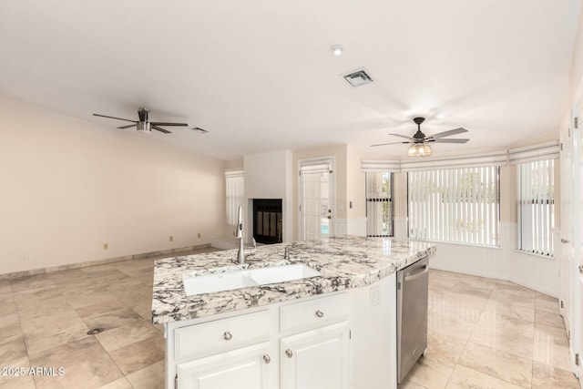 15602 N 19th St, Phoenix, AZ 85022 - kitchen with an island with sink, sink, stainless steel dishwasher, ceiling fan, and white cabinets