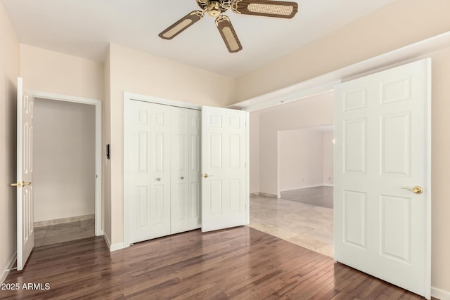 15602 N 19th St, Phoenix, AZ 85022 - unfurnished bedroom with ceiling fan, dark hardwood / wood-style floors, and a closet