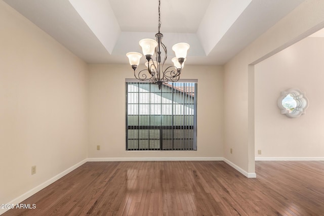15602 N 19th St, Phoenix, AZ 85022 - unfurnished dining area featuring a chandelier, wood-type flooring, and a raised ceiling
