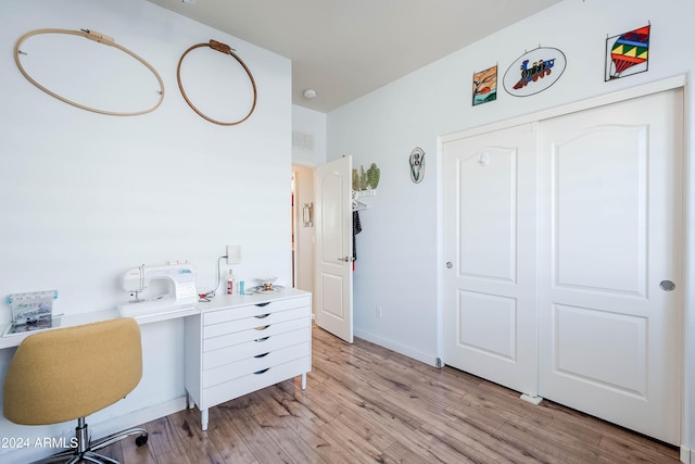 office with light hardwood / wood-style flooring