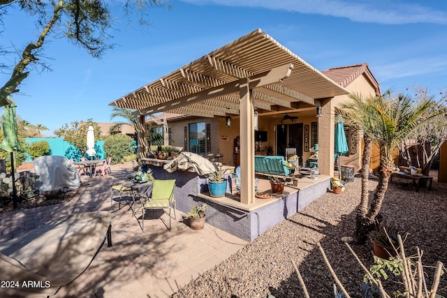 view of patio / terrace with outdoor lounge area, ceiling fan, a pergola, and grilling area