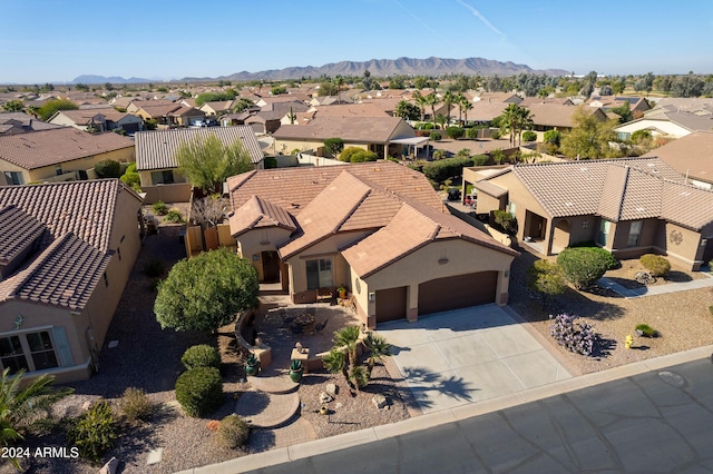 birds eye view of property with a mountain view