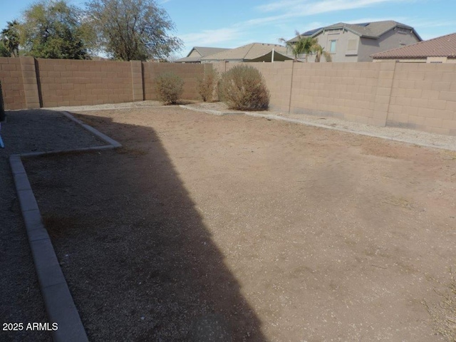 view of yard with a fenced backyard