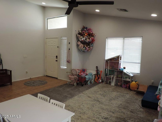 tiled foyer featuring high vaulted ceiling, baseboards, visible vents, and recessed lighting