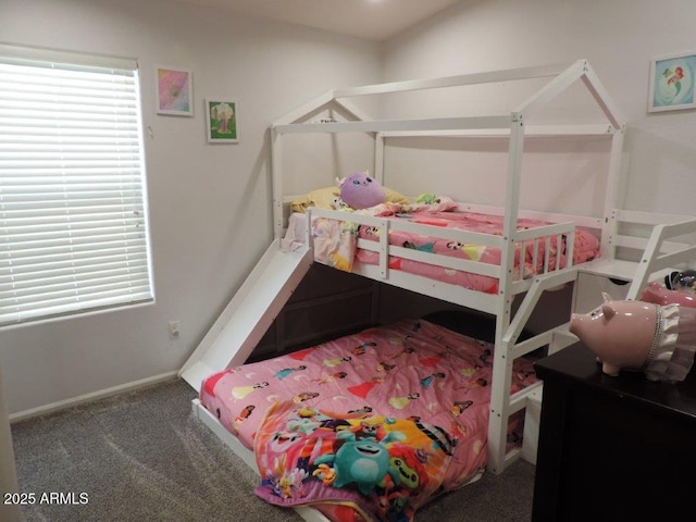 bedroom featuring multiple windows, carpet, and baseboards