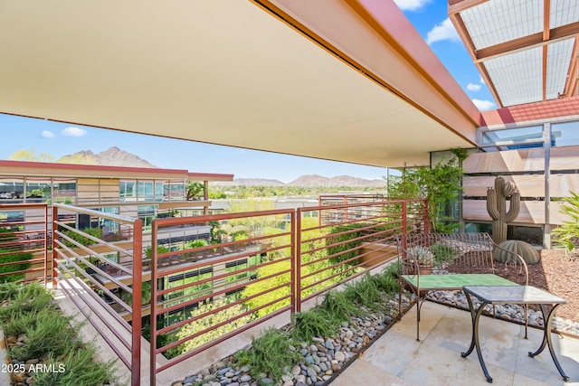balcony featuring a mountain view