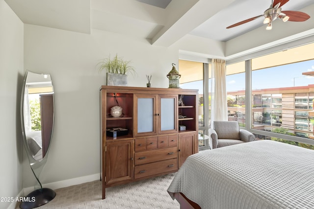 bedroom with baseboards, multiple windows, and ceiling fan