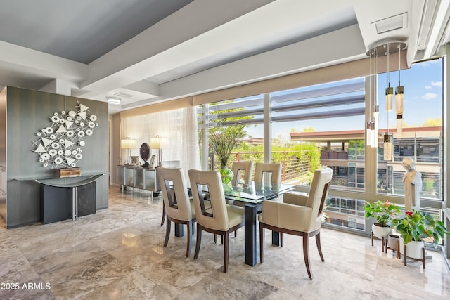 dining area featuring marble finish floor