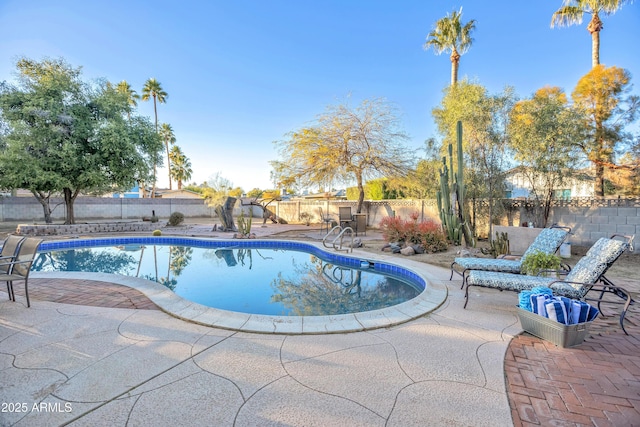 view of pool featuring a patio