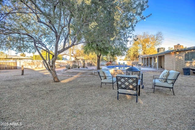 view of yard with a fenced in pool and a patio