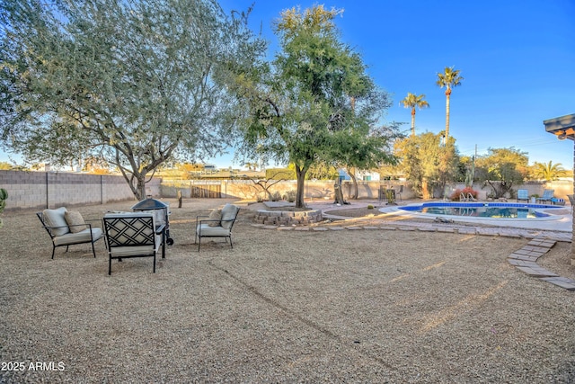 view of yard with a fenced in pool