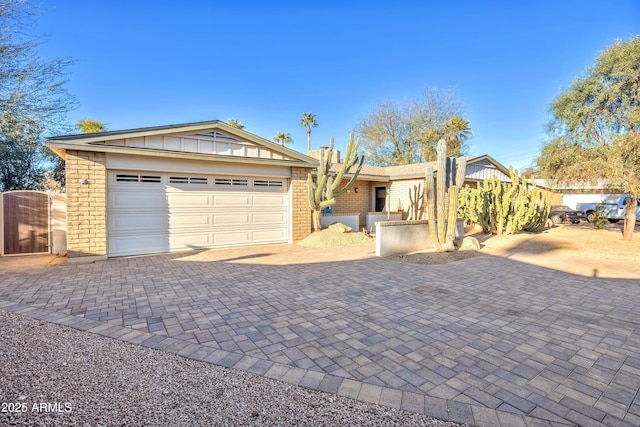 ranch-style house featuring a garage