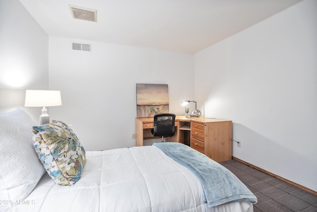 bedroom featuring dark colored carpet