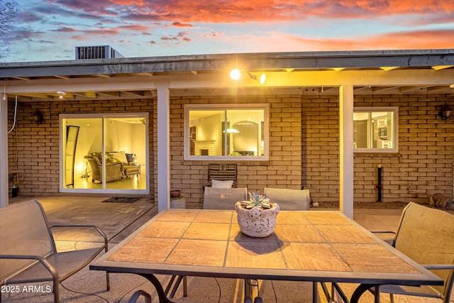 view of patio terrace at dusk