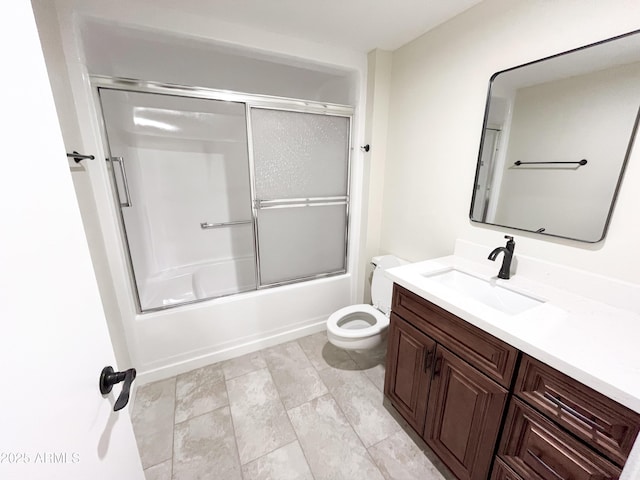 full bathroom with toilet, tile patterned floors, vanity, and shower / bath combination with glass door