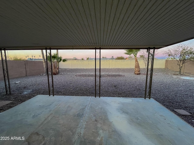 view of patio terrace at dusk