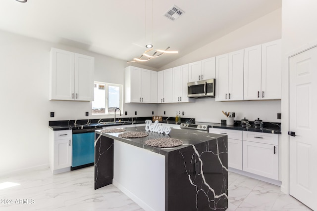 kitchen with a kitchen island, white cabinetry, pendant lighting, and stainless steel appliances