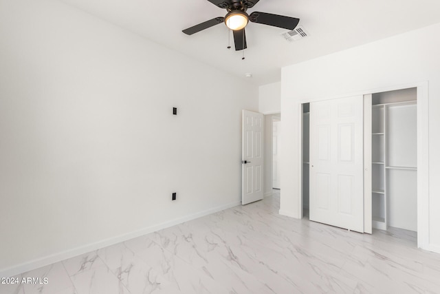 unfurnished bedroom featuring a closet, ceiling fan, and light tile patterned flooring