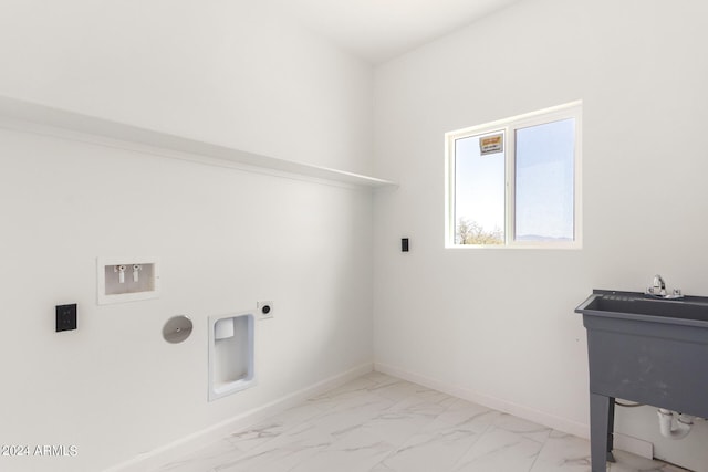 laundry room featuring electric dryer hookup and light tile patterned floors