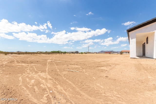 view of yard with a rural view