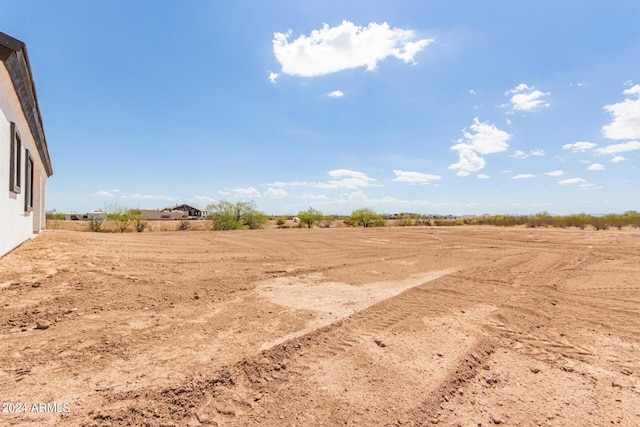 view of yard with a rural view