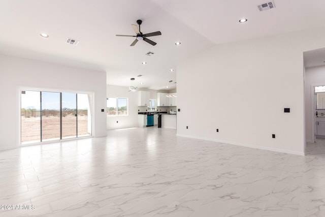 unfurnished living room featuring recessed lighting, visible vents, and baseboards