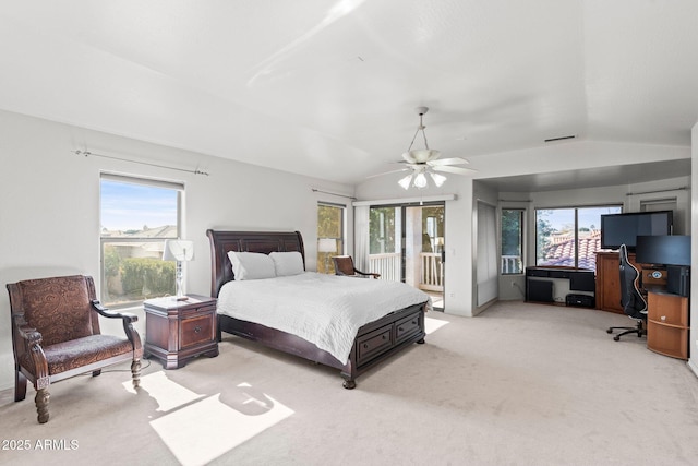 carpeted bedroom with lofted ceiling, multiple windows, and access to outside