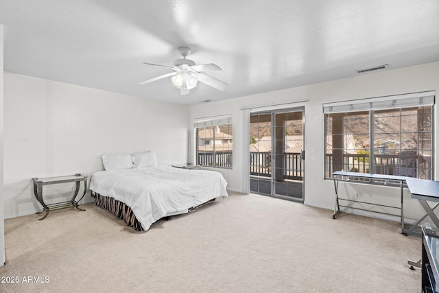 bedroom featuring carpet, access to outside, and ceiling fan