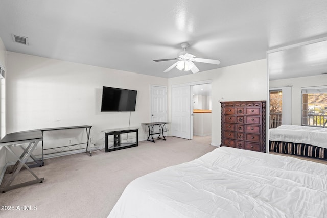 bedroom with light carpet and ceiling fan