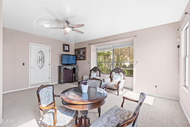 living room with light colored carpet and ceiling fan