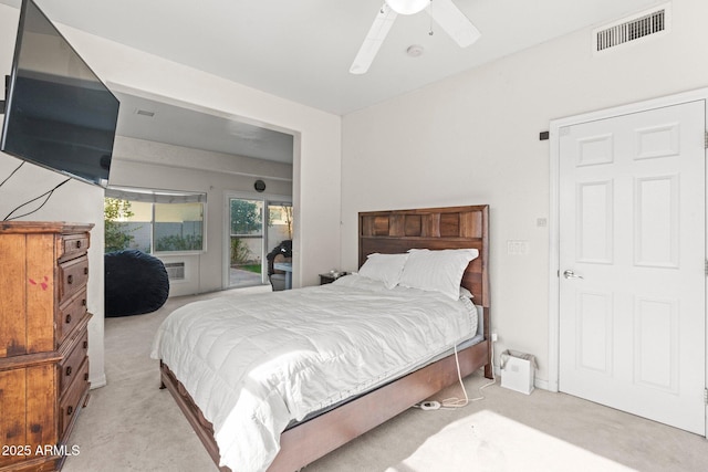 carpeted bedroom with ceiling fan and access to outside