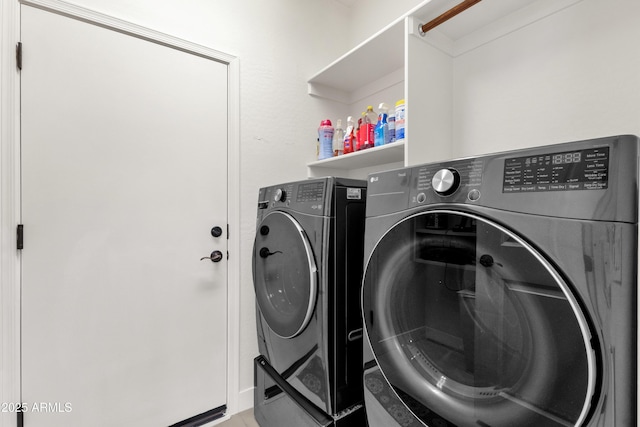 washroom featuring laundry area and independent washer and dryer