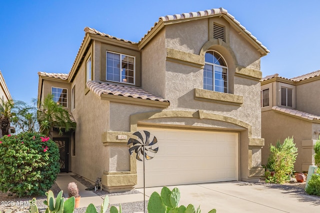 1451 E S Fork Dr, Phoenix, AZ 85048 - mediterranean / spanish home with an attached garage, a tiled roof, concrete driveway, and stucco siding