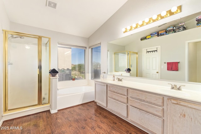 1451 E S Fork Dr, Phoenix, AZ 85048 - full bath with a shower stall, lofted ceiling, a bath, double vanity, and wood finished floors