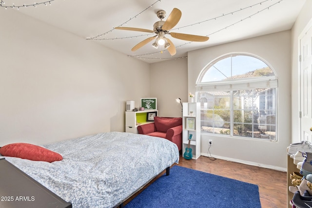 1451 E S Fork Dr, Phoenix, AZ 85048 - bedroom with wood finished floors, baseboards, and a ceiling fan