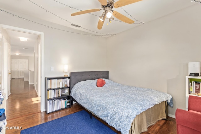 1451 E S Fork Dr, Phoenix, AZ 85048 - bedroom with wood finished floors, a ceiling fan, and baseboards