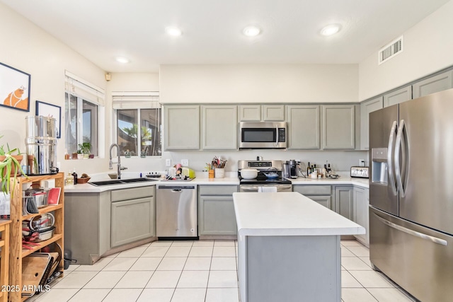 1451 E S Fork Dr, Phoenix, AZ 85048 - kitchen featuring appliances with stainless steel finishes, gray cabinets, a sink, light countertops, and light tile patterned floors