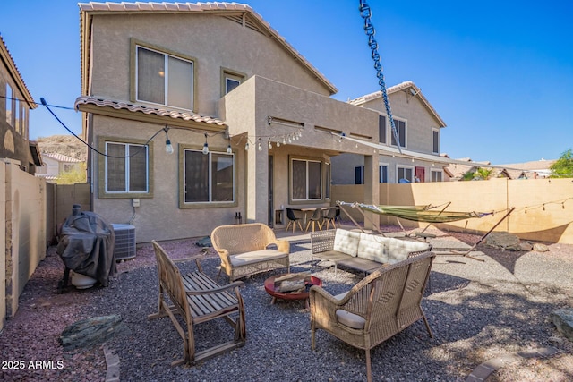 1451 E S Fork Dr, Phoenix, AZ 85048 - back of property with stucco siding, an outdoor living space with a fire pit, a tile roof, a patio, and a fenced backyard