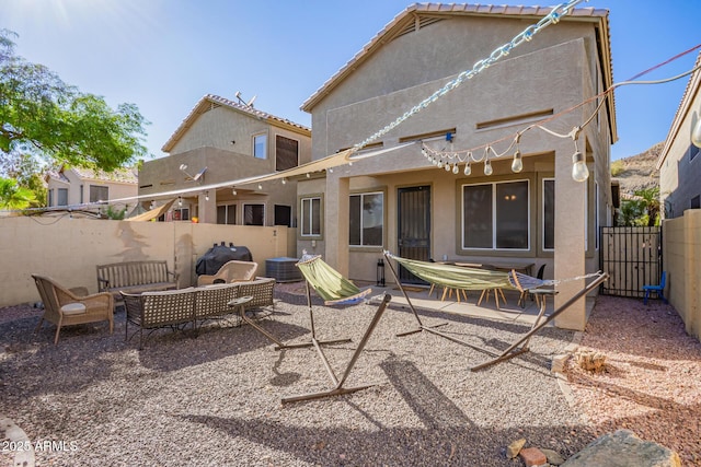 1451 E S Fork Dr, Phoenix, AZ 85048 - rear view of property featuring stucco siding, a patio area, outdoor lounge area, and cooling unit