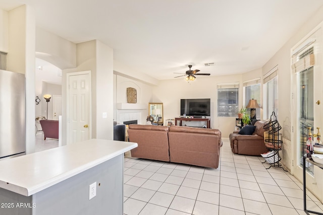 1451 E S Fork Dr, Phoenix, AZ 85048 - living area with a ceiling fan, a tile fireplace, and light tile patterned floors