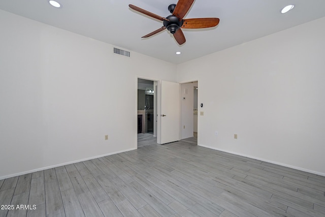 unfurnished room featuring ceiling fan and light hardwood / wood-style flooring