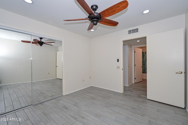 unfurnished room featuring ceiling fan and light wood-type flooring