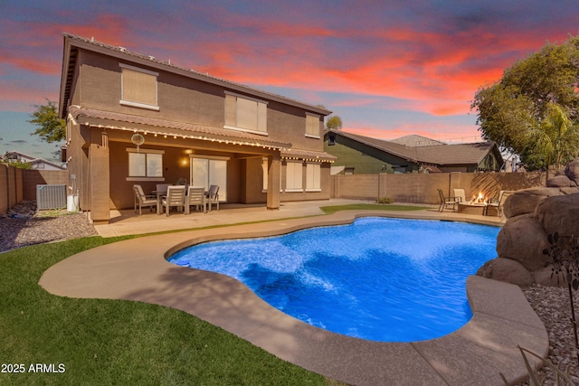 view of swimming pool featuring cooling unit, a fenced backyard, a fenced in pool, and a patio