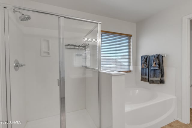 full bath featuring a bath and a stall shower
