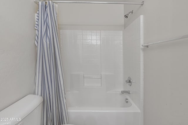 full bathroom featuring toilet and shower / bath combination with curtain
