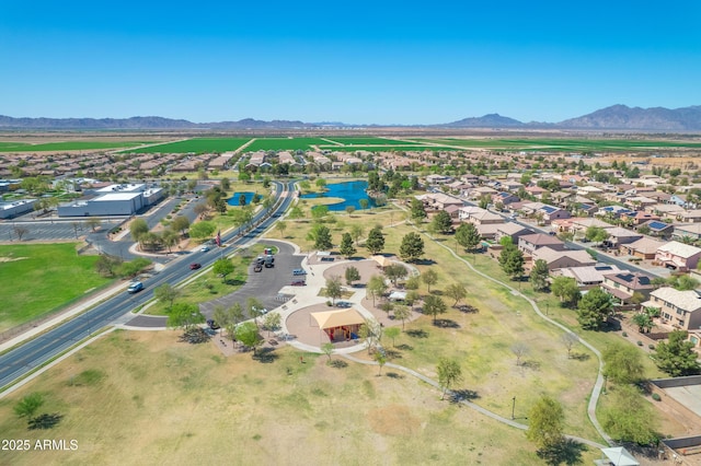 birds eye view of property featuring a residential view and a water and mountain view