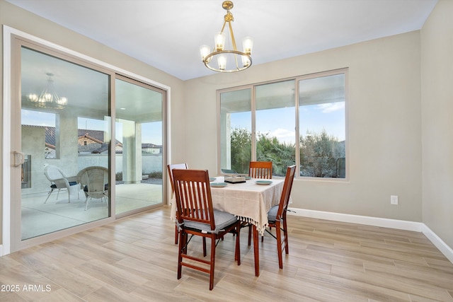 32128 S Bighorn Dr, Oracle, AZ 85623 - dining room featuring a chandelier and light wood-style floors