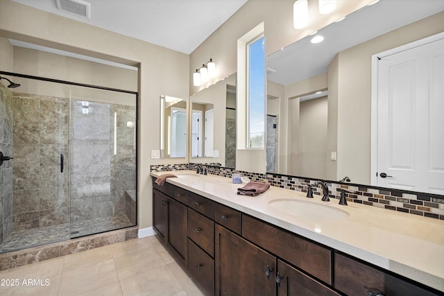 32128 S Bighorn Dr, Oracle, AZ 85623 - bathroom with a shower stall, double vanity, decorative backsplash, and tile patterned floors