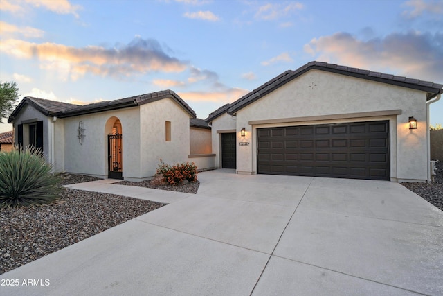 32128 S Bighorn Dr, Oracle, AZ 85623 - ranch-style house with driveway, a garage, stucco siding, and a tile roof
